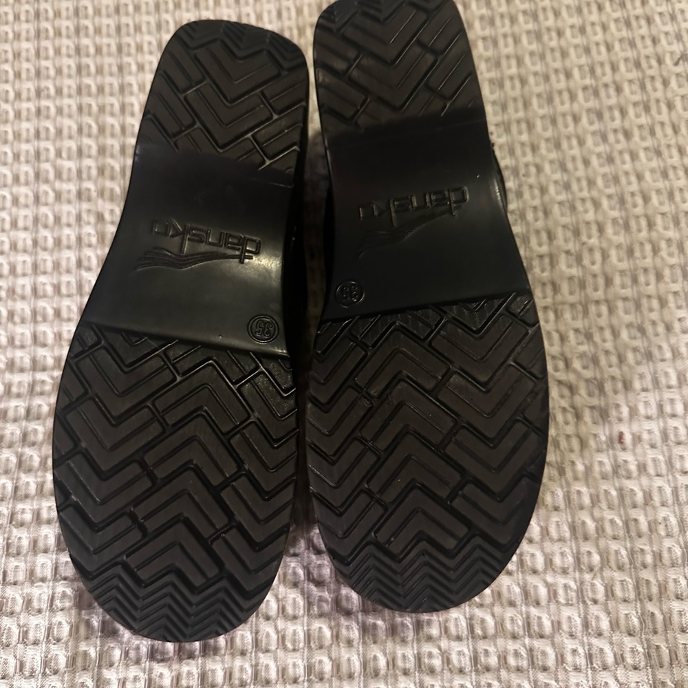 Dansko black leather clogs, new condition.